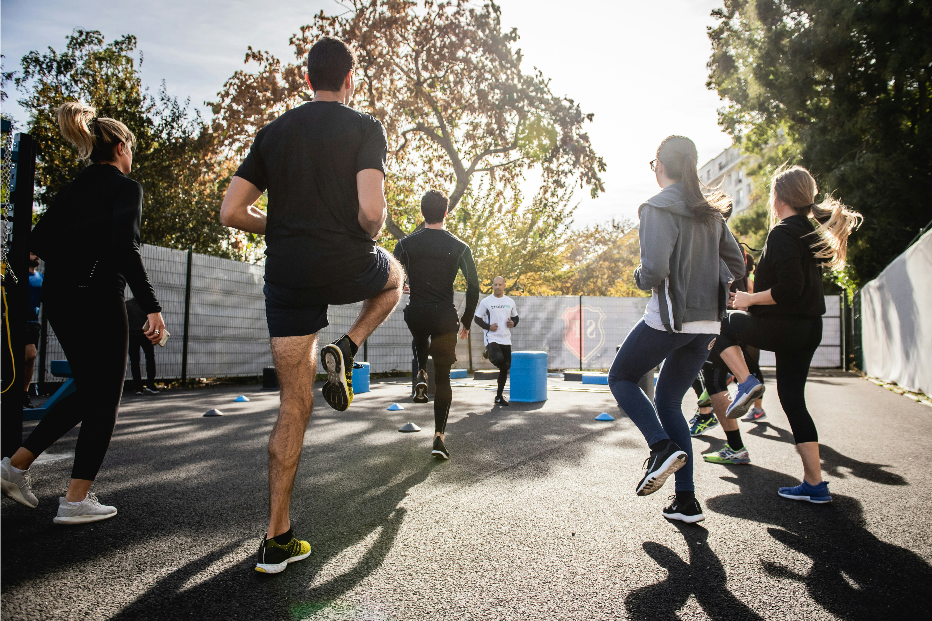 A group of people engaged in group exercise outdoors